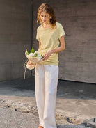 100% linen rolled cuff tee with relaxed scoop neckline and contrast inner lining