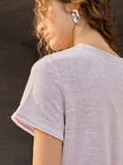 100% linen rolled cuff tee with relaxed scoop neckline and contrast inner lining