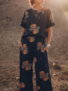 woman wearing soft-tailored loose fit co-ord set with wide-leg bottoms in light cotton fabric