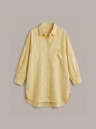 relaxed oversized 100% cotton linen shirt with dropped shoulders and back pleat detail on white background