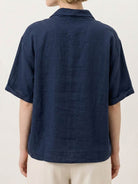 100% linen relaxed V-neck top with asymmetric button detail and short sleeves in breathable fabric