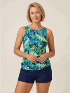 woman wearing high-neck ruched tankini set with gathered sides and swim skirt bottom at the beach