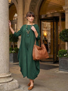Bohemian maxi dress in loose fit linen blend with long sleeves and floor length design