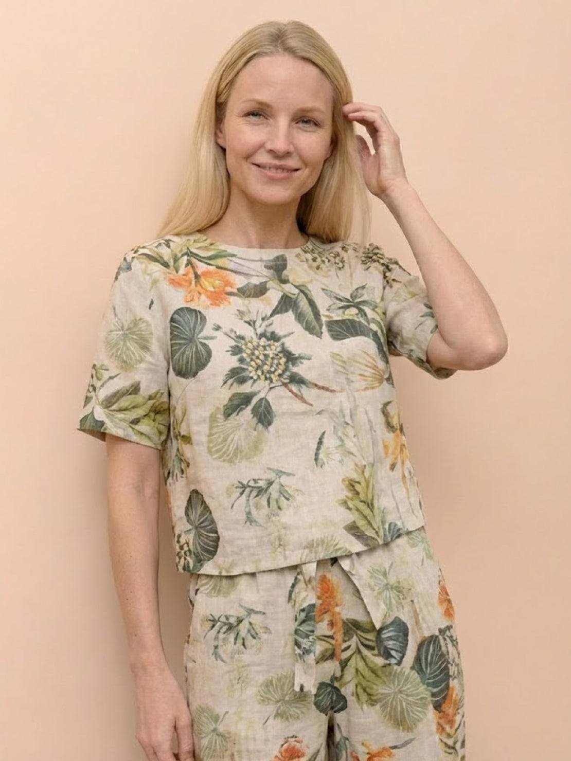 Woman wearing relaxed fit 100% cotton linen set in monochrome tones with breathable fabric and adjustable waist pants