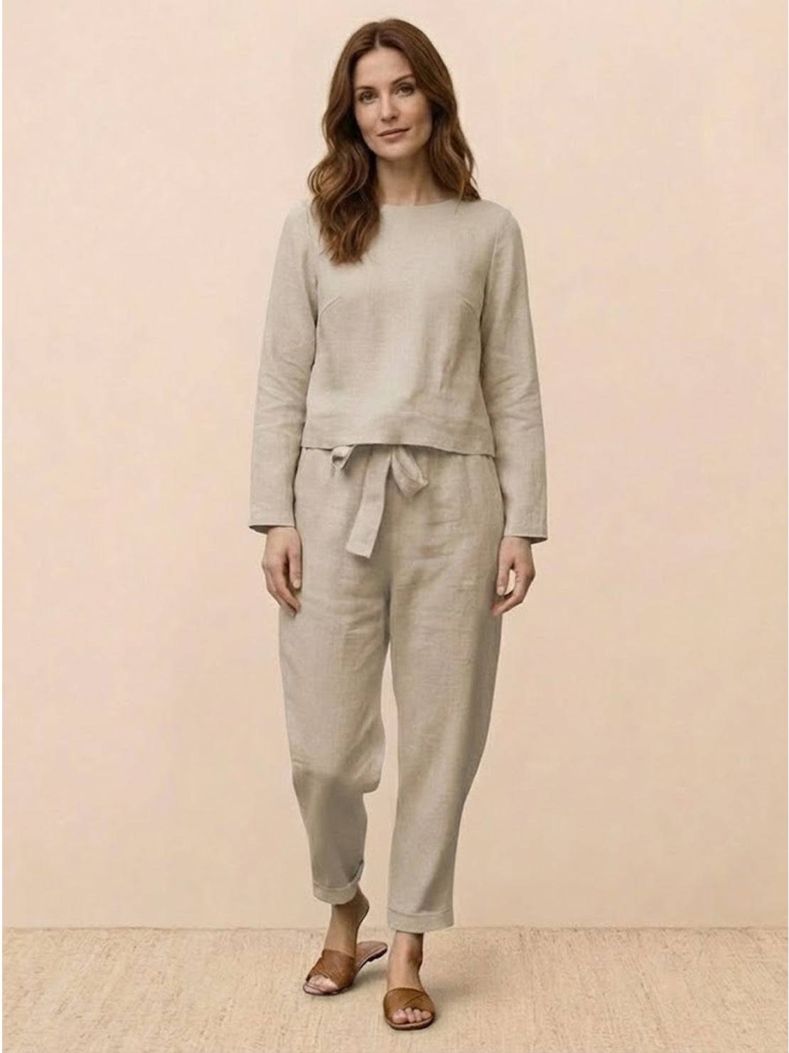 Woman wearing Cotton-Linen Monochrome relaxed longline top and wide-leg pants set in soft, natural fabric