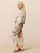 Minimalist cotton-linen monochrome capsule outfit with relaxed longline top and wide-leg pants