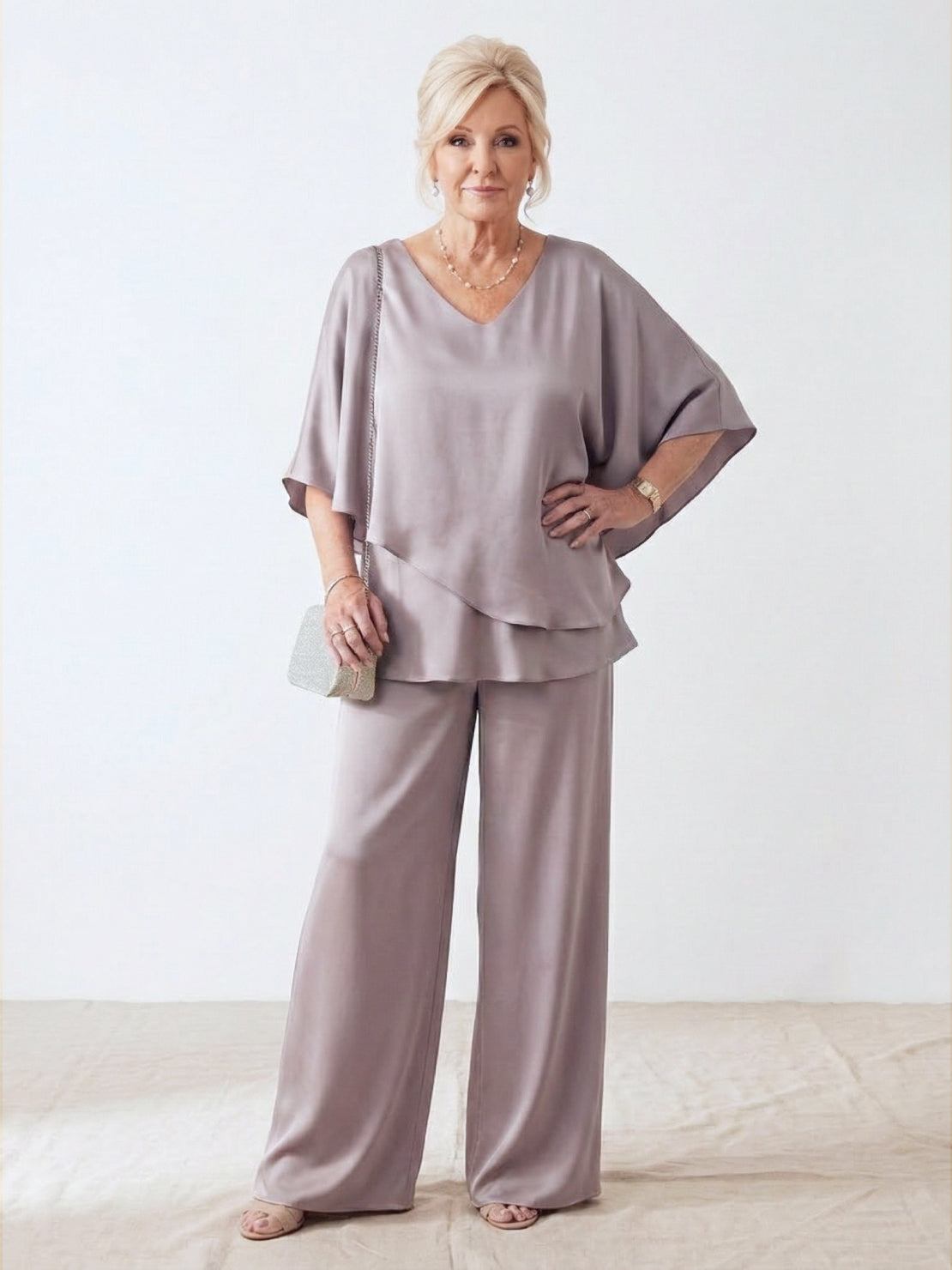 Elegant Layers Two-Piece Set featuring a flattering layered V-neck top and comfortable matching pants in lightweight wrinkle-resistant fabric