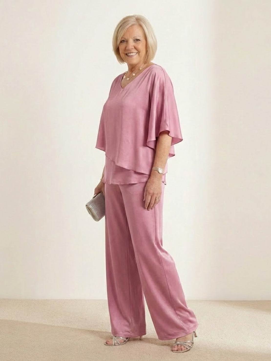 woman wearing Elegant Layers Two-Piece Set with layered V-neck top and matching pants in soft fabric