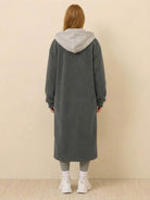 back view of cozy grey everyday wear oversized sherpa long coat with hood worn by woman