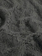Close-up of soft gray sherpa fabric for everyday wear oversized coat lining