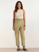 Woman wearing high-waist wrapped comfy pants in casual setting