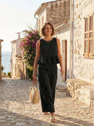 Lightweight beige two-piece linen-like feel set with breathable fabric and relaxed fit for travel and everyday comfort