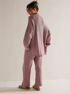 woman wearing multi-weather comfort two-piece oversized set with cropped wide pants and long sleeves outdoors