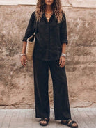 Woman wearing oversized 100% cotton shirt and wide-leg pants co-ord set in a relaxed, breathable style