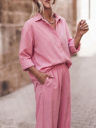 Woman wearing oversized 100% cotton shirt and wide-leg pants co-ord set in relaxed style