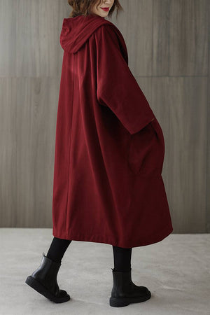 One size oversized water-resistant windbreaker jacket with waterproof design and attached hood in deep red.