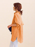 Oversized linen shirt in breathable cotton-linen blend with relaxed fit and back button details