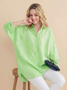 Oversized linen shirt in breathable cotton-linen blend with relaxed fit and back button detailing