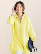 Oversized linen shirt in breathable cotton-linen blend with relaxed fit and back button detailing