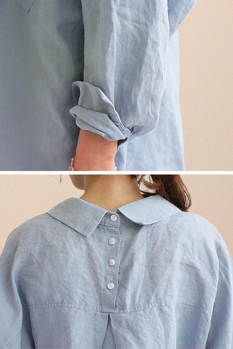 Light blue oversized linen shirt with rolled sleeves and buttoned back detail