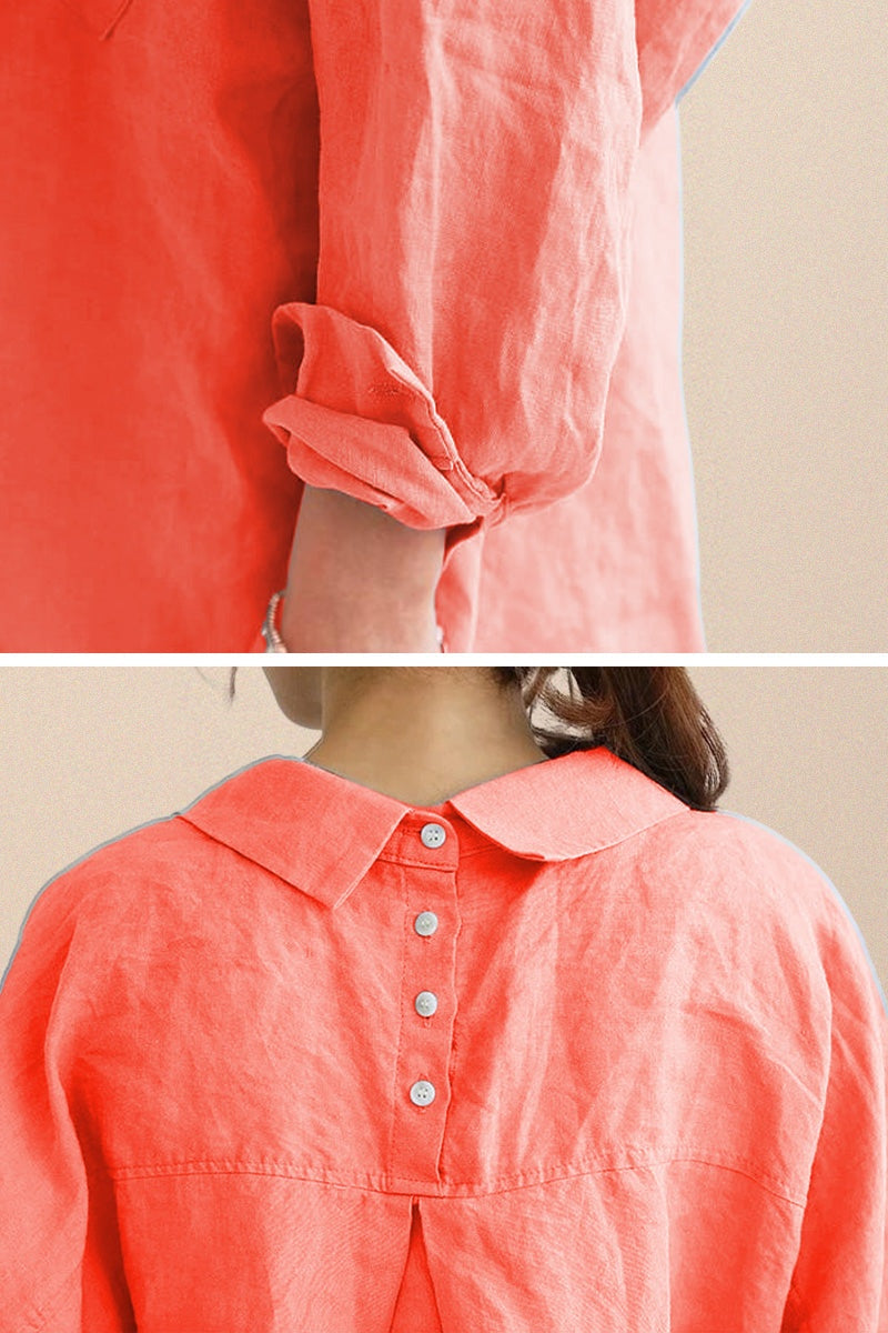 Close-up of oversized linen shirt in sun-washed pink with rolled sleeves and back button detail
