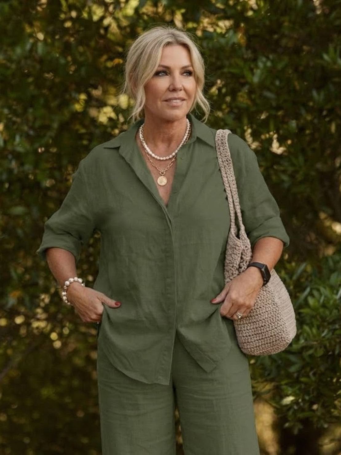 Woman wearing oversized 100% cotton shirt and wide-leg pants co-ord set in olive green outdoors
