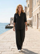 Model wearing oversized 100% cotton shirt and wide-leg pants co-ord set in relaxed style