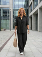 Model wearing oversized 100% cotton shirt with wide-leg pants co-ord set in relaxed fit