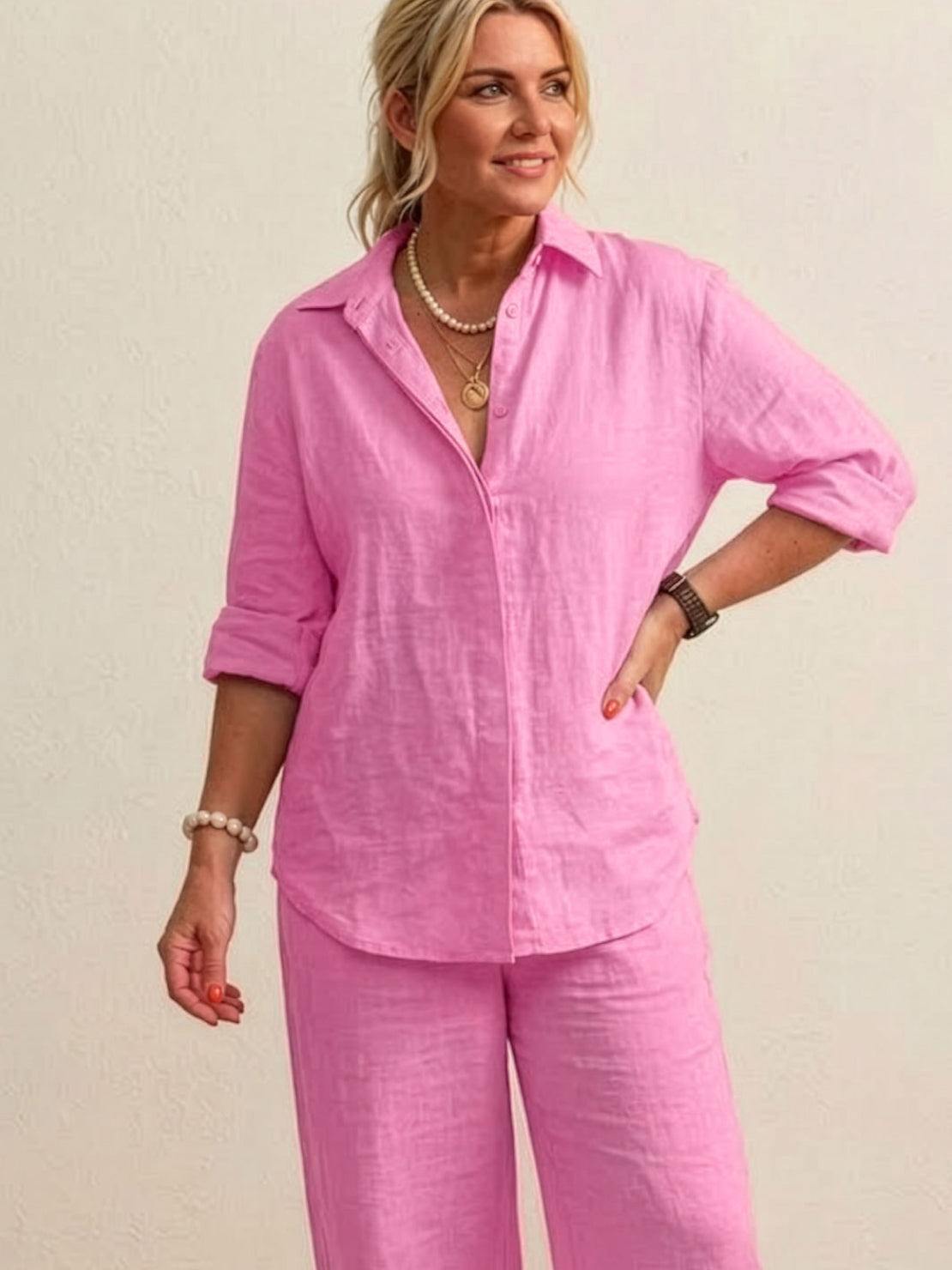 Woman wearing oversized 100% cotton pink shirt and wide-leg pants co-ord set