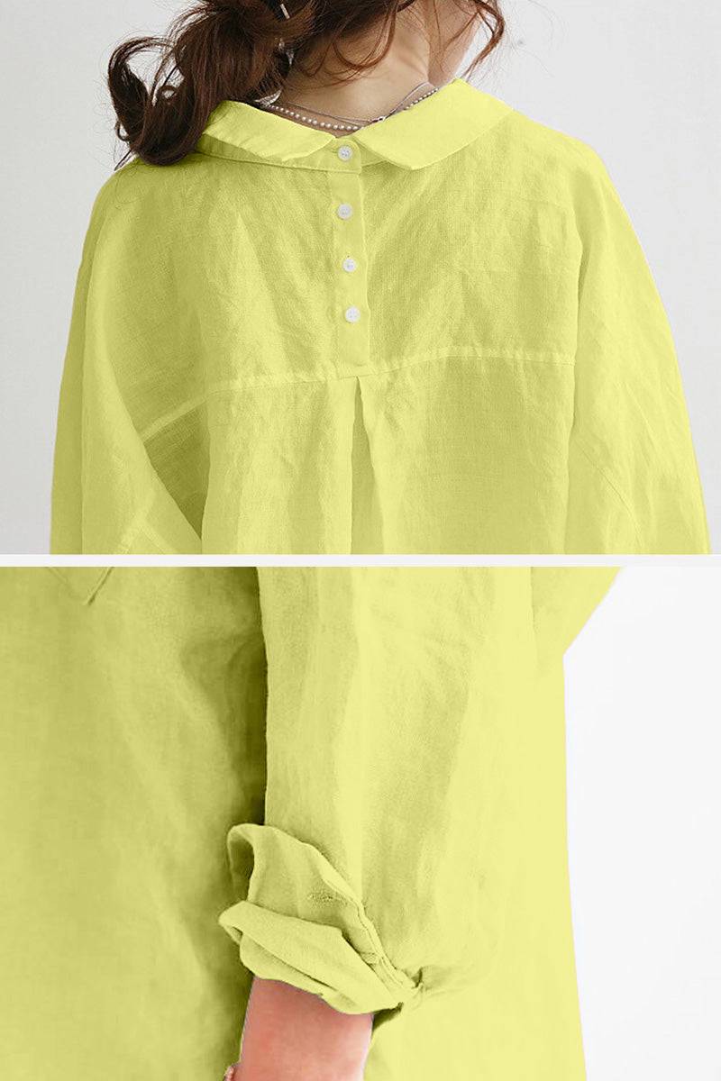 Yellow oversized linen shirt with buttoned back and rolled-up sleeves, breathable and lightweight fabric.