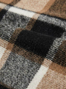 Oversized medium-length blue plaid overshirt jacket with wool-blend fabric and functional pockets