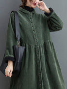 Oversized vintage corduroy coat in warm earth tones with thick texture and deep pockets for winter layering