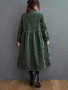 Oversized vintage corduroy coat in warm earth tones with thick textured fabric and deep pockets for cold weather comfort