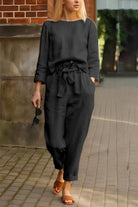 woman wearing 100 cotton linen black monochrome two-piece set walking outdoors