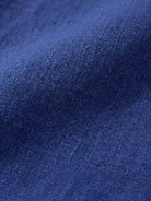 Close-up of blue cotton fabric texture for Timeless Class cotton dress
