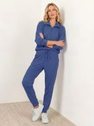 Unisex half-zip pullover and matching sweatpants set for casual comfort and relaxed fit