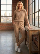 Unisex half-zip pullover and sweatpants set in relaxed fit with soft fabric for everyday comfort