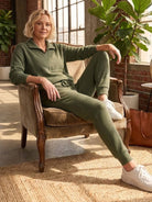 Unisex half-zip pullover and matching sweatpants set in soft polyester fabric for relaxed fit and everyday comfort