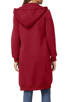 Back view of oversized long zip sweatshirt hoodie in red with hood and long sleeves