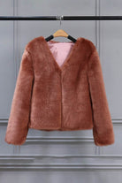 Bold faux fur luxe jacket with V neckline and button front closure in soft, lightweight faux mink blend.