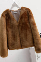 Bold faux fur luxe jacket with button front closure and V neckline, soft and lightweight faux/mink fur blend, long sleeves, loose fit.